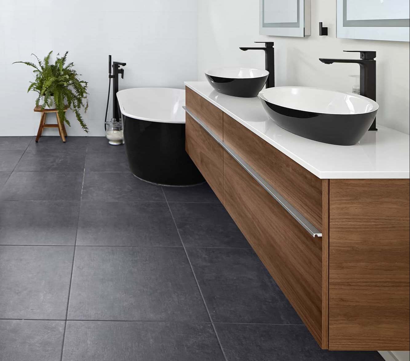 bathroom renovation with floating vanity his and her sinks and freestanding tub in markham