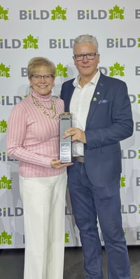 Anne and Dwayne Butler receiving Best Adaptive Renovation award 2026