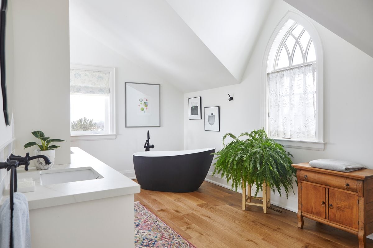 Bathroom with LVP flooring and black tub renovation in Markham, Ontario