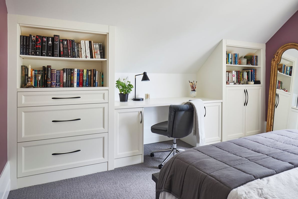 Bedroom with office and bookshelves on either side in Markham home renovation