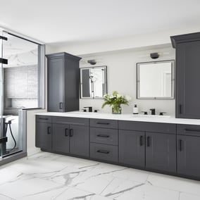 Double vanity in Toronto bathroom renovation with gray shaker cabinets and black pulls