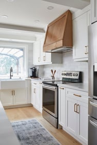 Engineered hardwood flooring in Markham kitchen renovation with wood range hood