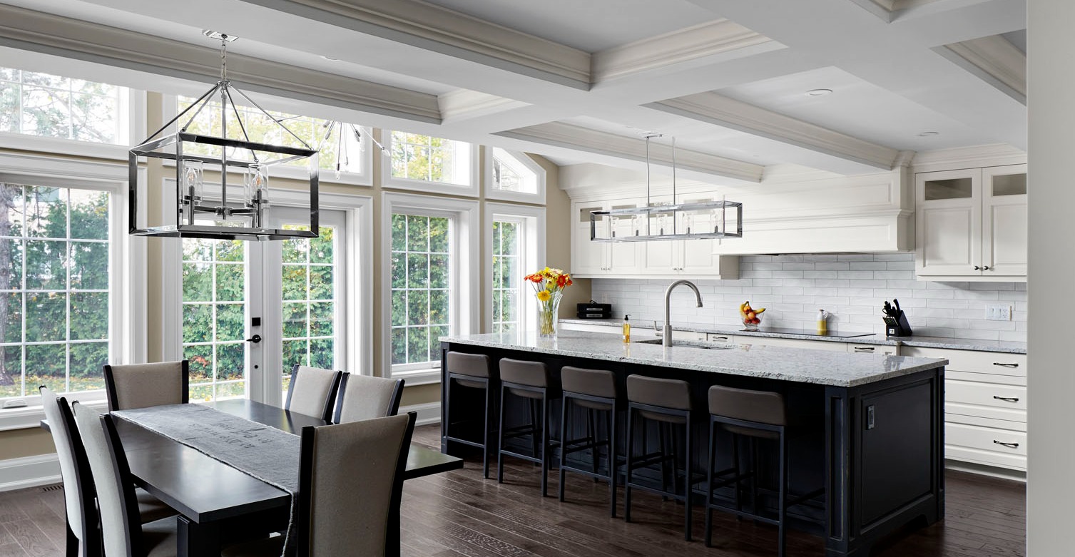 coffered ceiling in kitchen with large island and dining room table by markham design build firm master edge homes