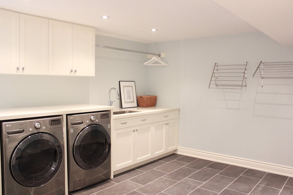 Large format tile in Markham basement renovation with custom cabinetry 