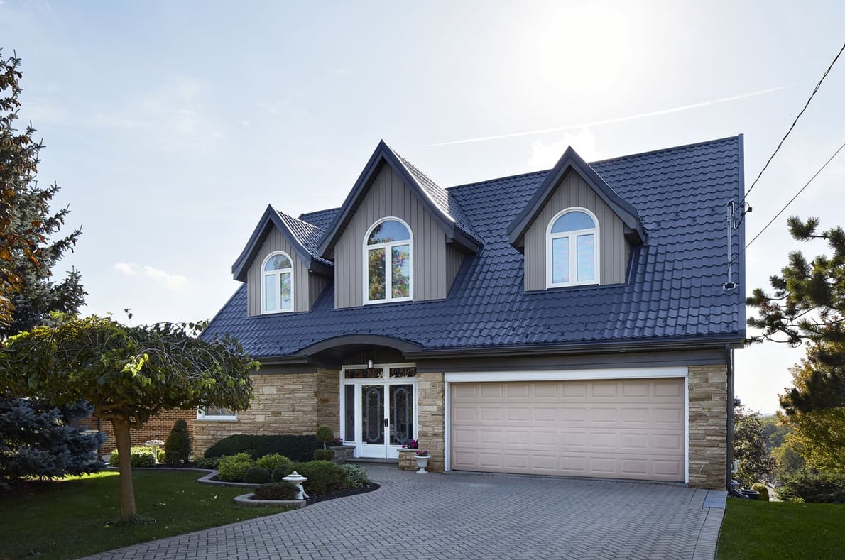 Modern exterior of Markham home on sunny day with attached garage