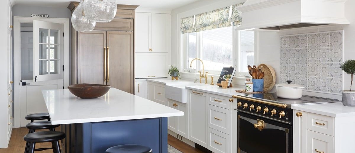gut renvation Kitchen with island white cabinets and gold faucets and handles in Markham