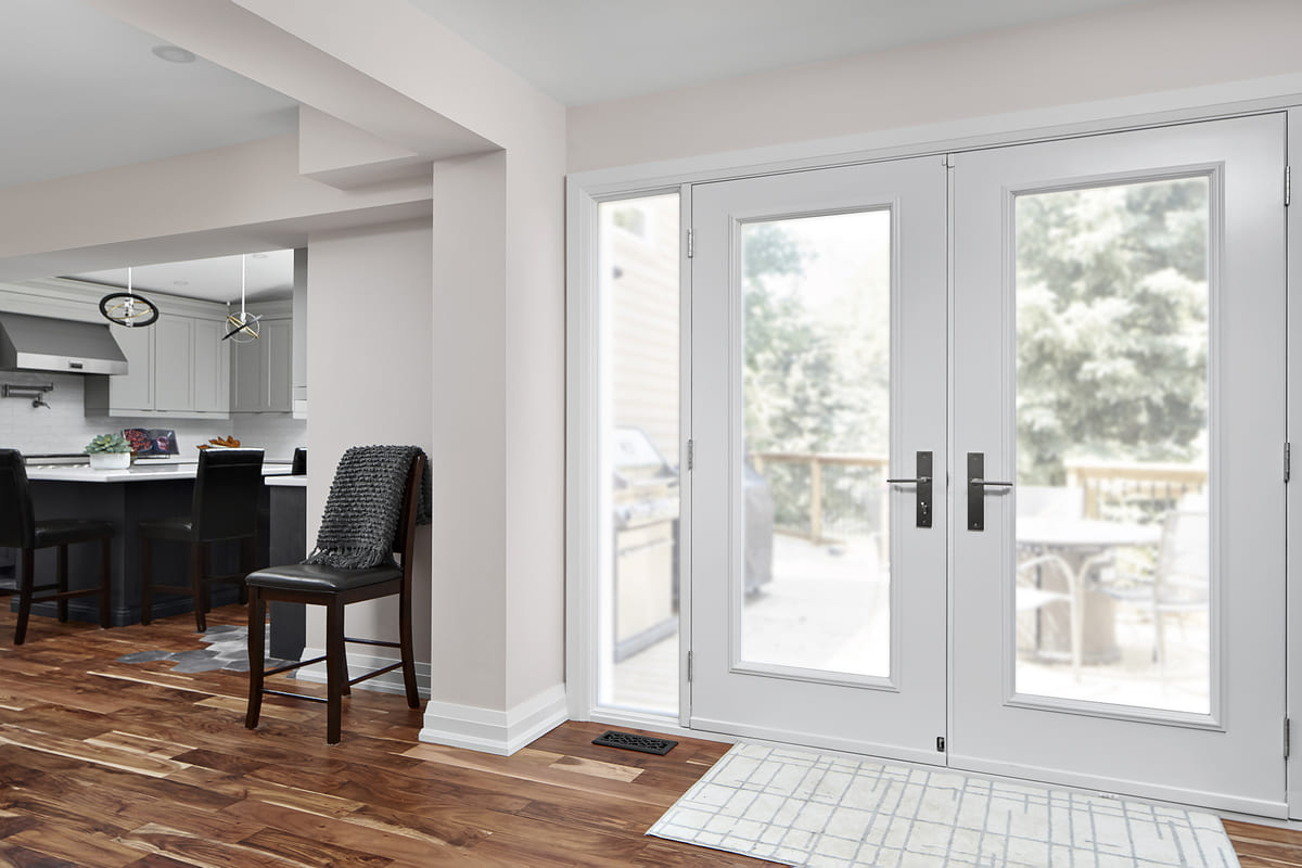 LVP flooring in Markham home main floor renovation with doors to patio