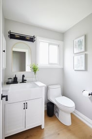 Luxury powder room in Markham renovation with matte black fixtures