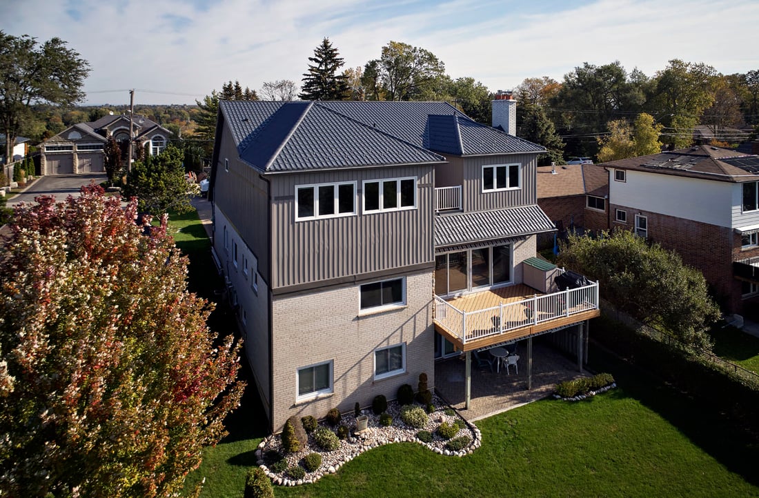 Home addition exterior with raised deck and under deck living space