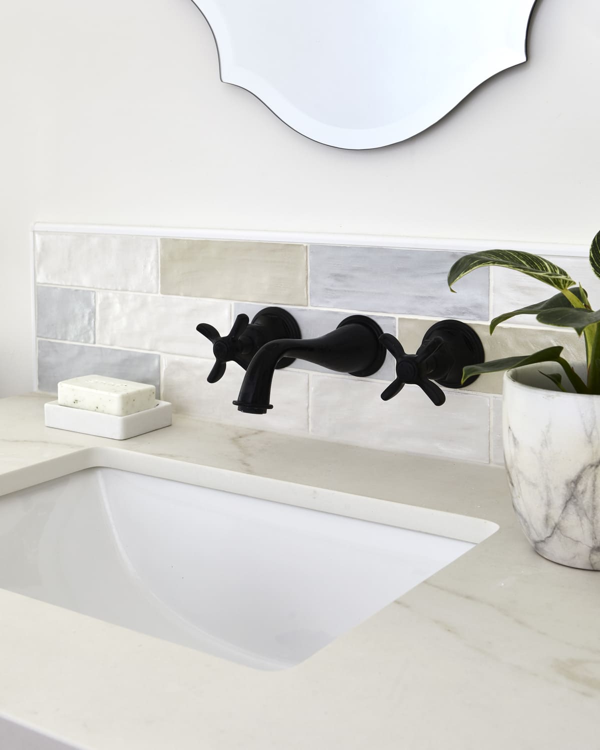 Matte black wall-mounted faucet fixture on subway tile in Markham bathroom renovation