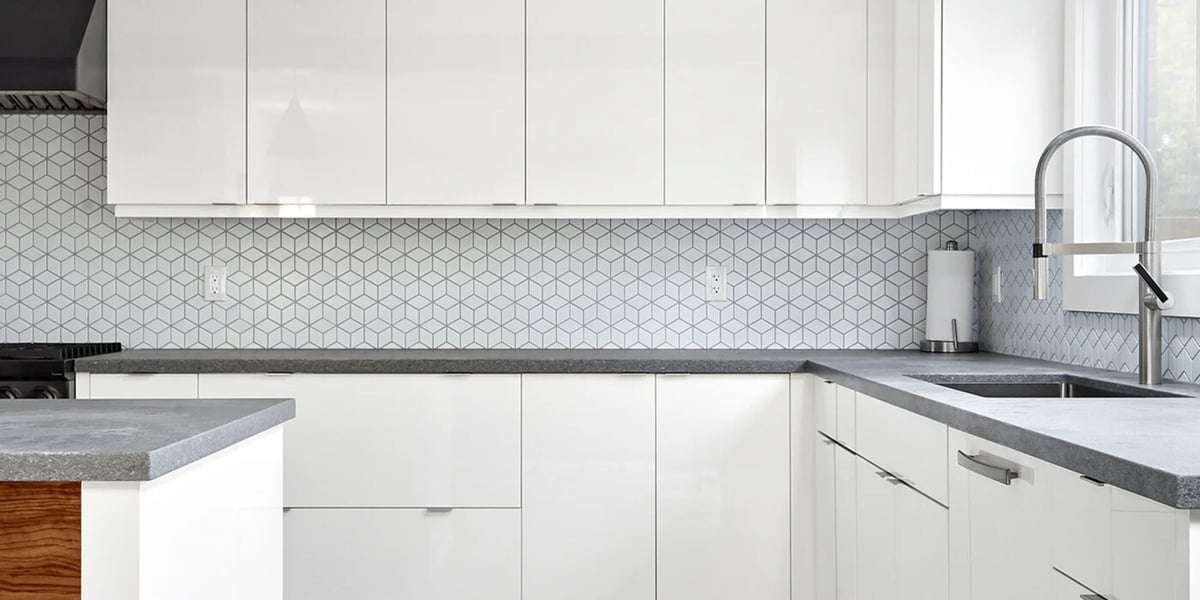 Mosaic kitchen backsplash behind white flat panel cabinets in Markham, Ontario-1
