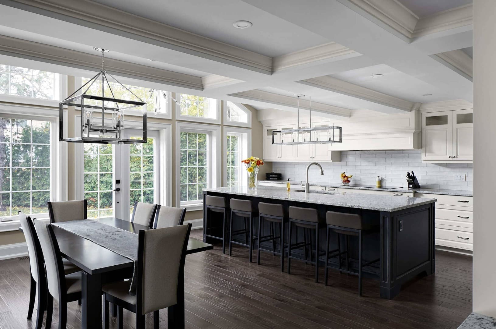 Open-Concept Kitchen Renovation With Island and Seating and Hanging Light Fixtures