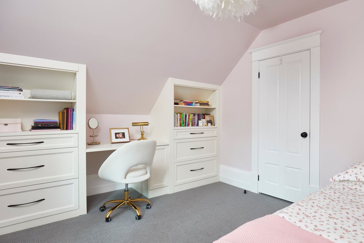 Pink bedroom with office and bookshelves in Markham home renovation