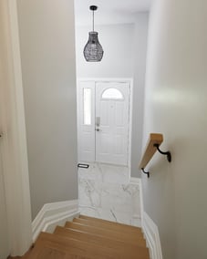 Staircase view of Markham home entryway with tile flooring