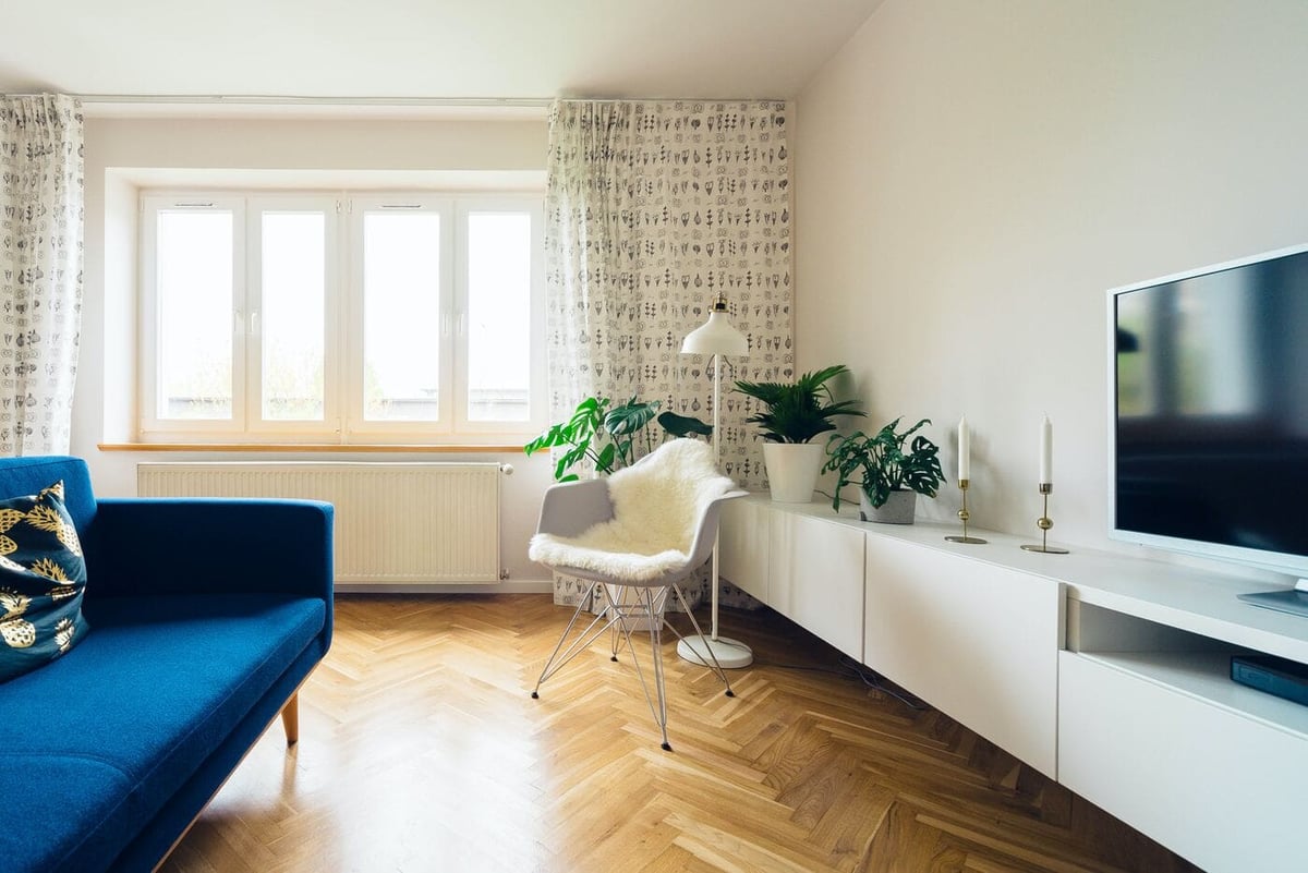Wood chevron flooring pattern in modern home