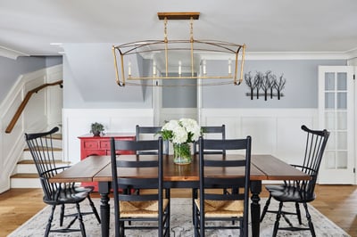 Wooden dining room table with gold chandelier light (1)