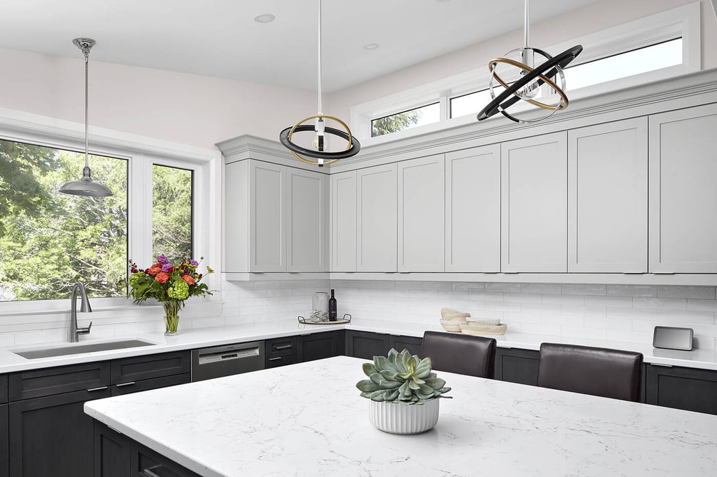 circular shaped pendant lighting above massive kitchen island in markham renovation