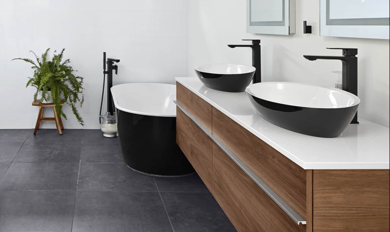 floating sink vanity with freestanding bathtub in bathroom renovation in markham