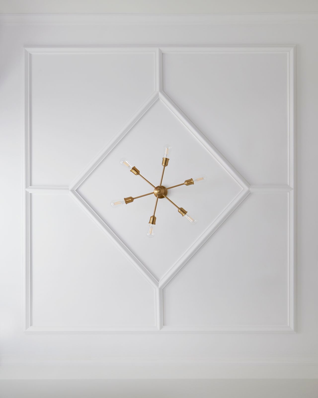 gold pendant lighting fixture off ceiling in markham home renovation wainscotted ceiling