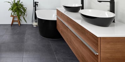 Large format square floor tiles in luxury bathroom renovation
