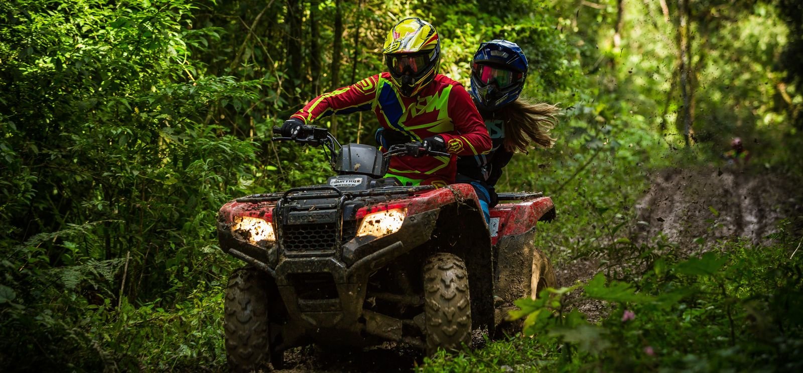 man and woman riding an ATv in muskoka ontario (1)