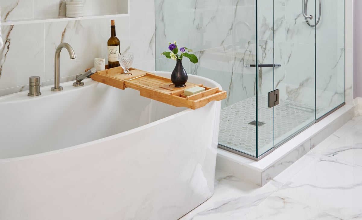 Marble bathroom renovation with freestanding tub next to shower in Markham