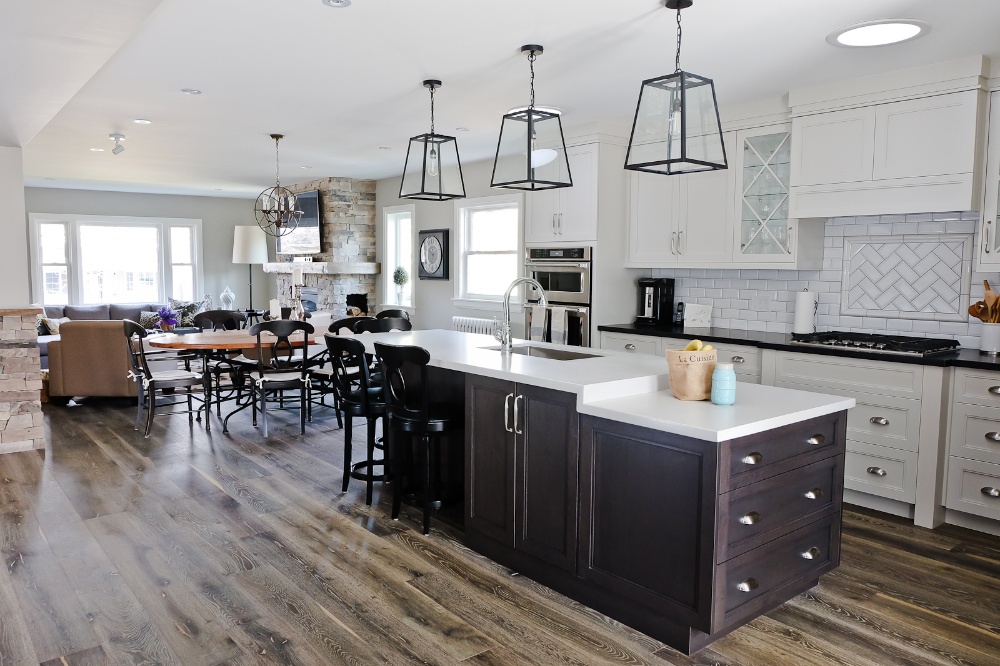 markham design-build home renovation kitchen with white cabinets and living room in background