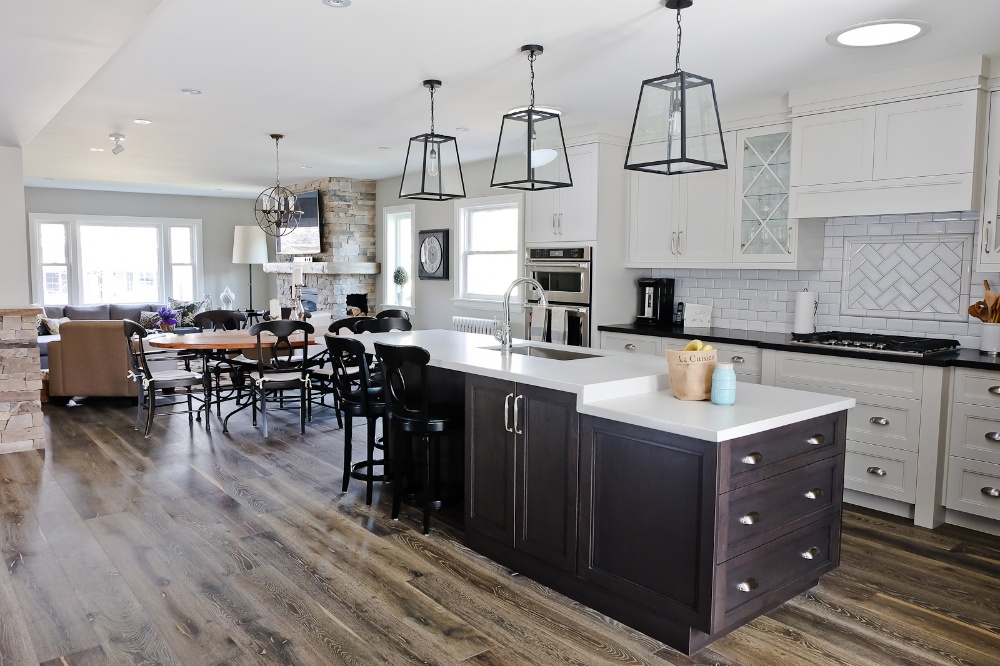 Modern kitchen renovation in open-concept home with white tile backsplash