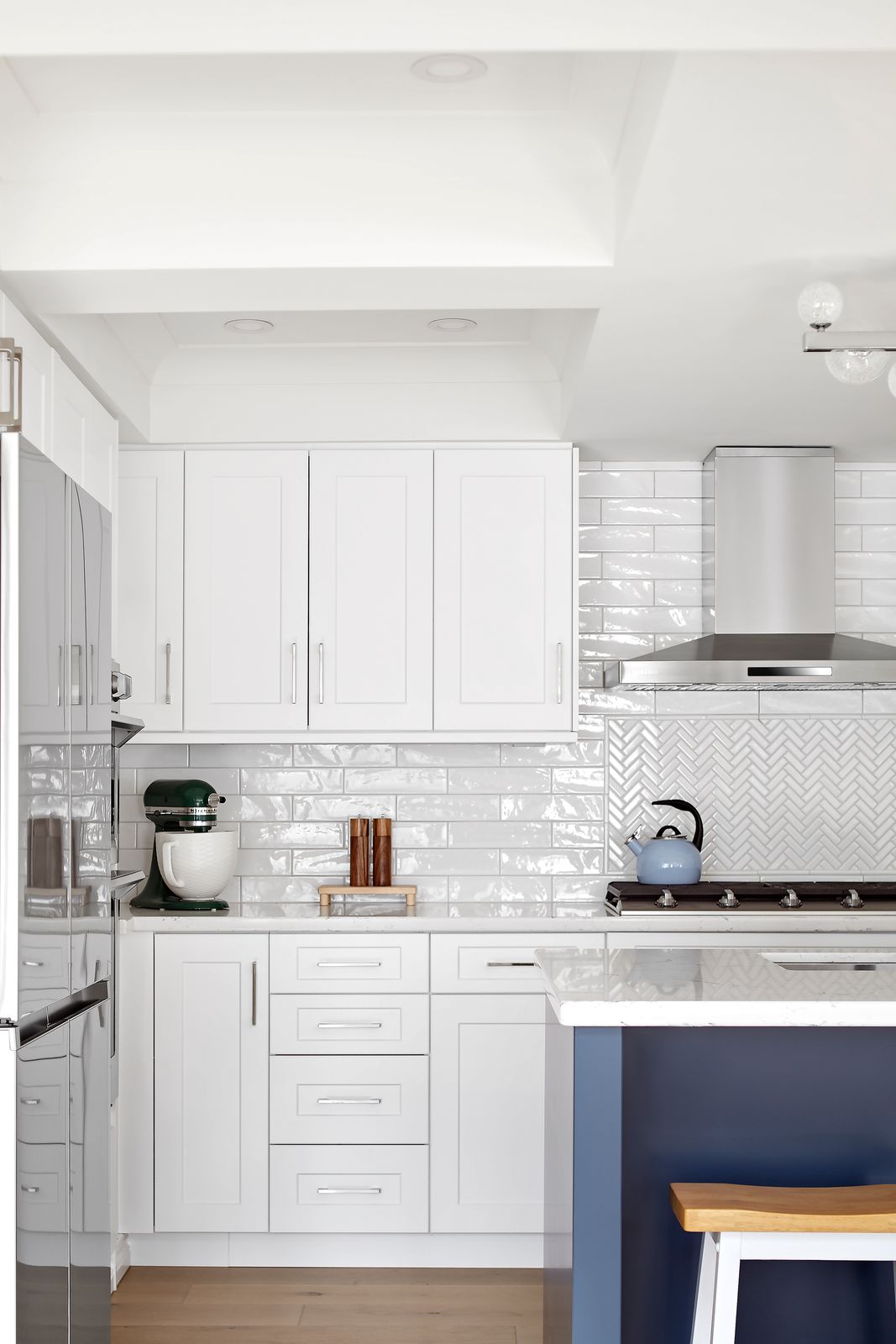 modern white kitchen cabinets with white tile backsplash in markham ontario