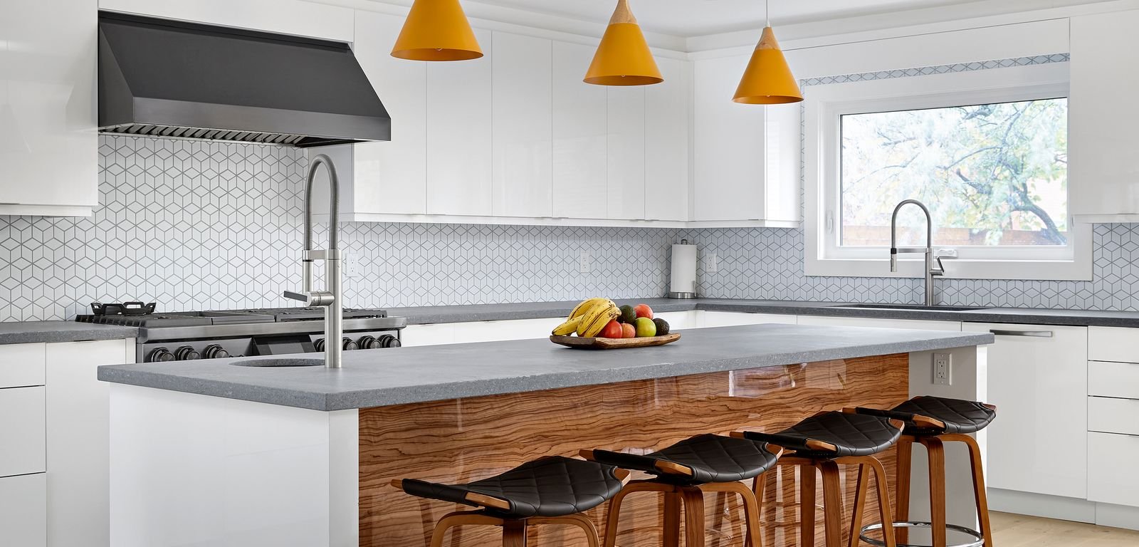 netzero custom kitchen renovation with barstool at island yellow pendant lights and hexagonal backsplash in markham