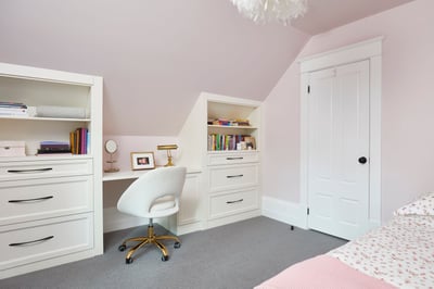 pink bedroom with office and bookshelves on either side in markham home renovation