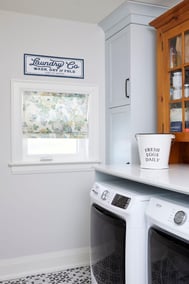 renovated laundry room with built in cabinets