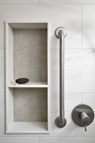 shower nook with hexagonal tile and aging in place handle feature in bathroom renovation in markham ontario