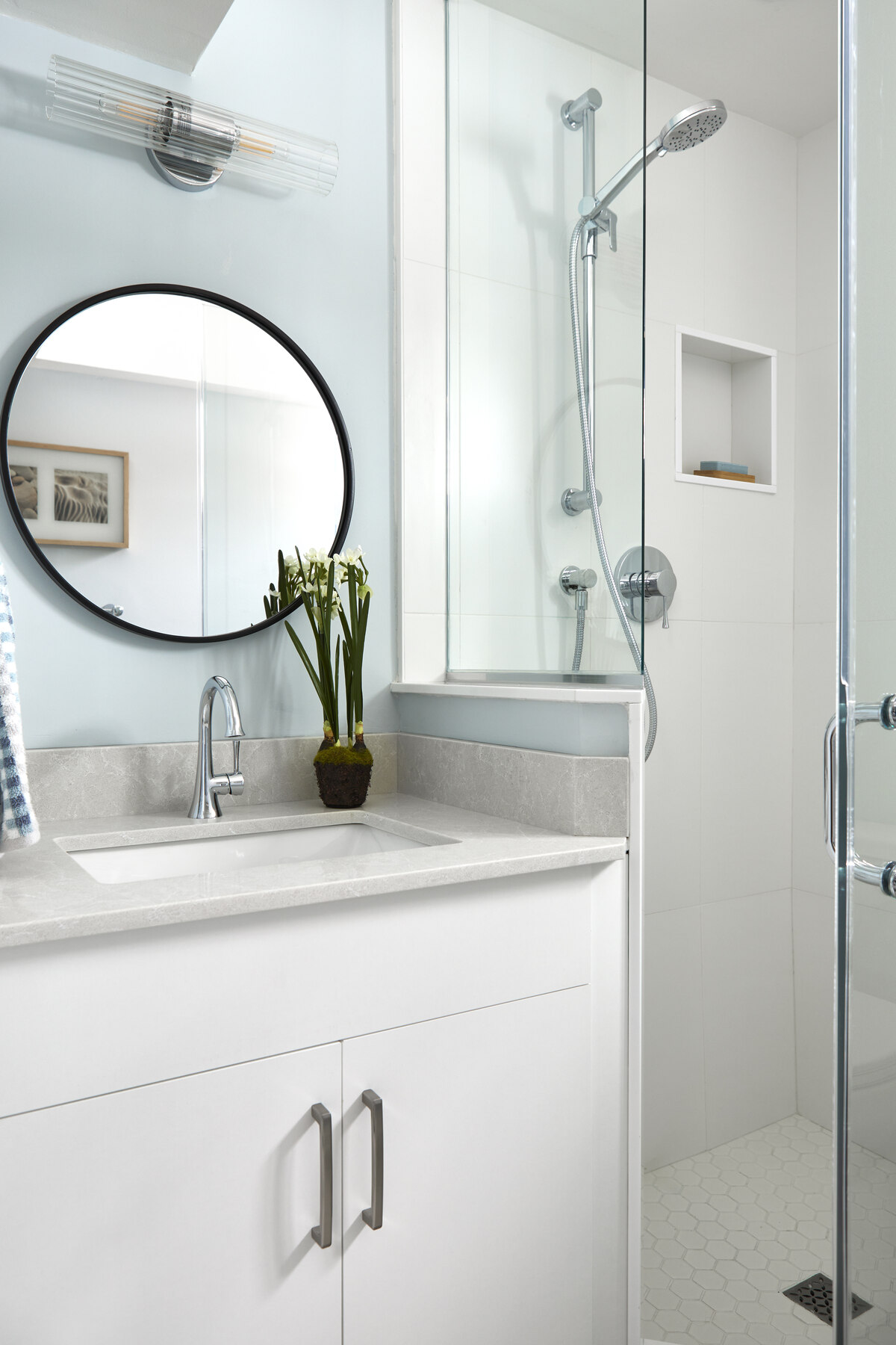 vanity in bathroom with shower
