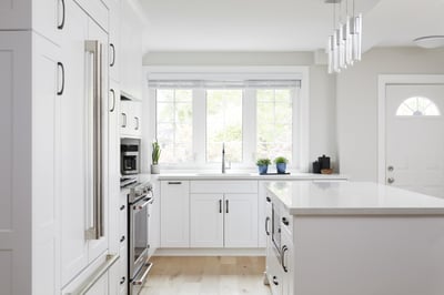 white modern kitchen renovation with white kitchen island in markham