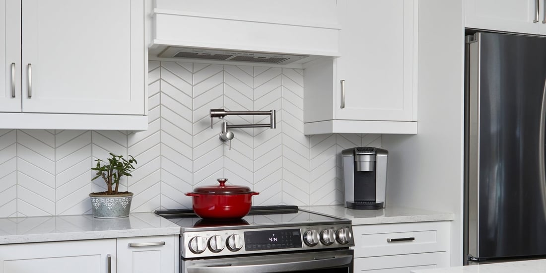 White chevron tile backsplash in kitchen