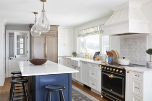 white kitchen island with blue cabinet renovation in markham