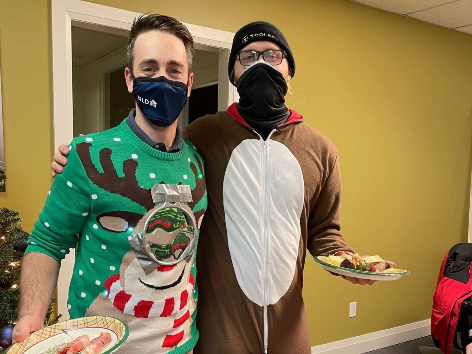 master edge homes construction employees in christmas costumes smiling in office (1)-1