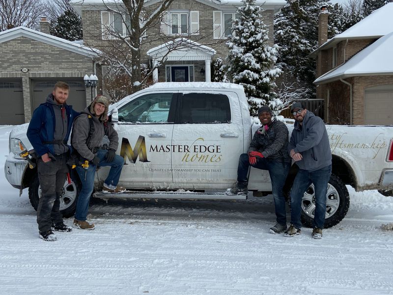 master edge truck with guys posing in snow in markham